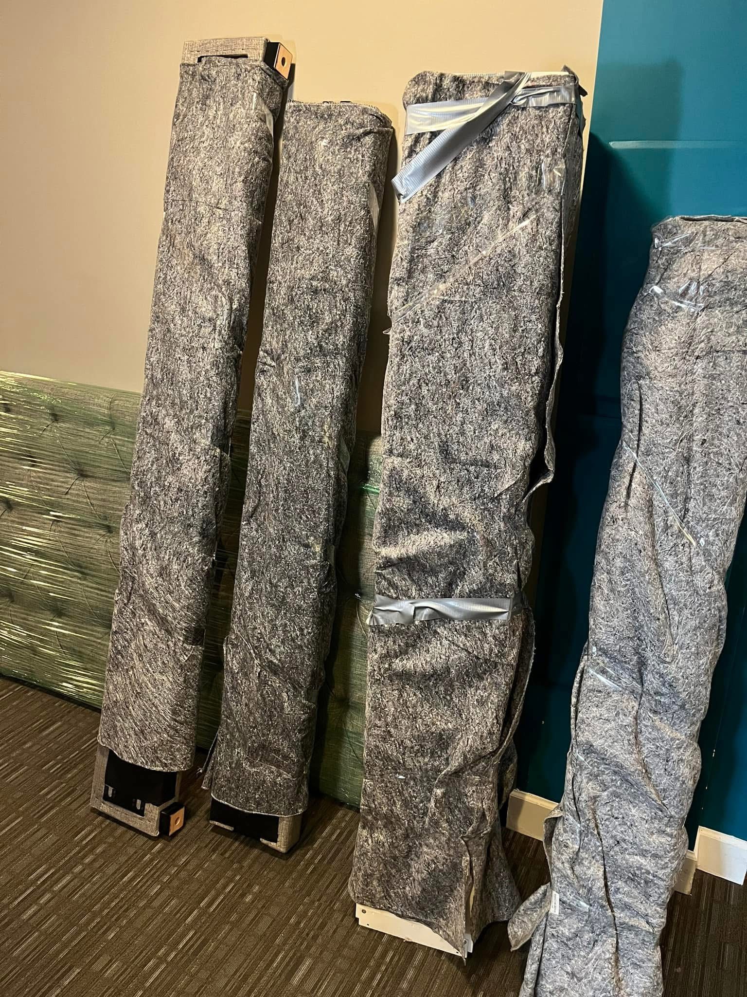 Large furniture protected with moving blankets